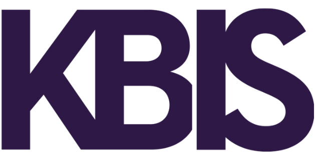 The image shows the bold, dark purple letters KBIS in all caps on a transparent background.