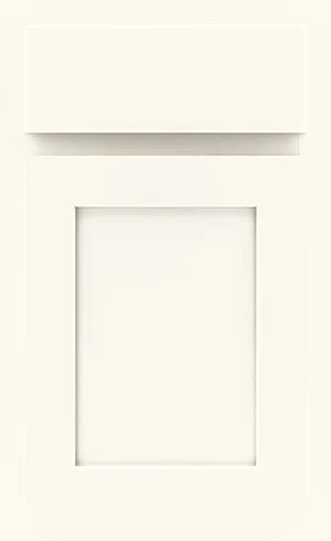 A cream-colored, shaker-style cabinet door with a rectangular recessed panel and a matching horizontal drawer front above.