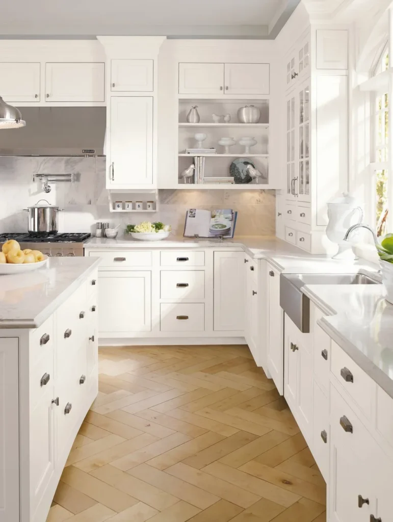 Bright kitchen featuring white shaker cabinets and a farmhouse sink.