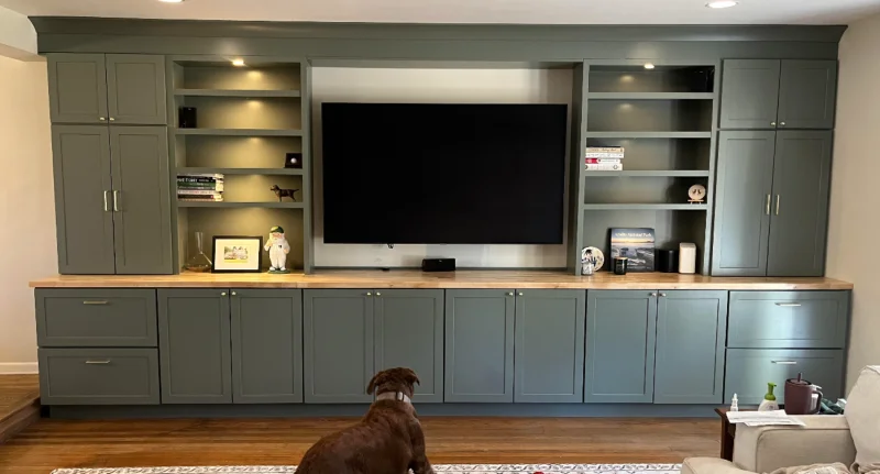 Custom cherry wood mudroom entryway lockers featuring built-in bench seating.