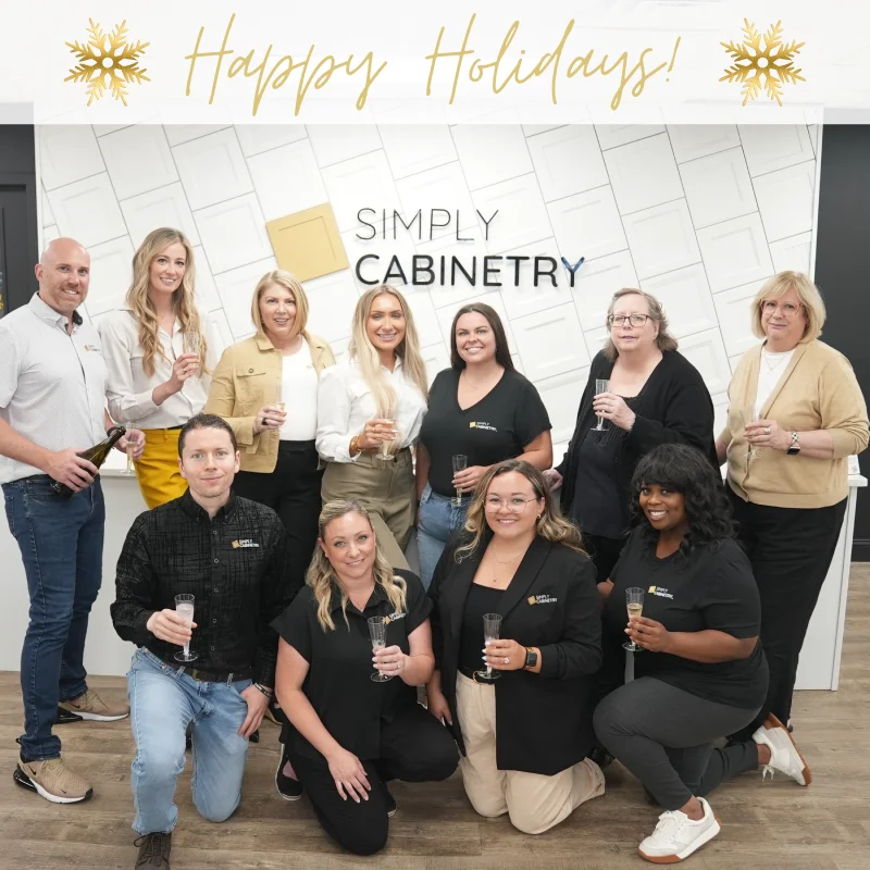 The Simply Cabinetry franchise team posing together inside their office.