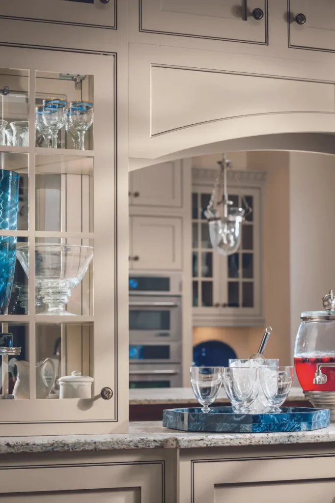 Modern grey wall kitchen cabinet with an open lift up door.