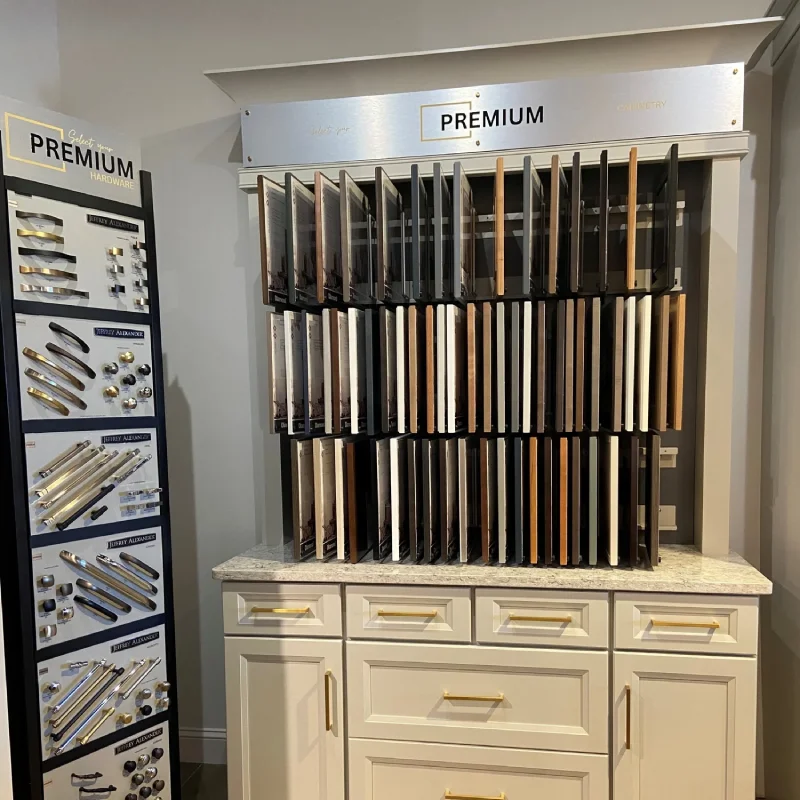 A showroom display featuring a wide selection of cabinet hardware and wood finish samples.