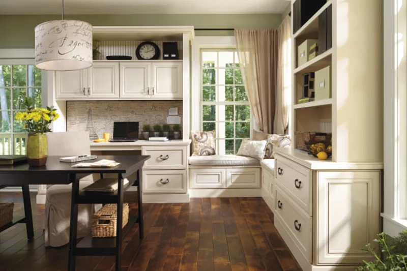 Home office featuring custom white built-in cabinets and desk space.