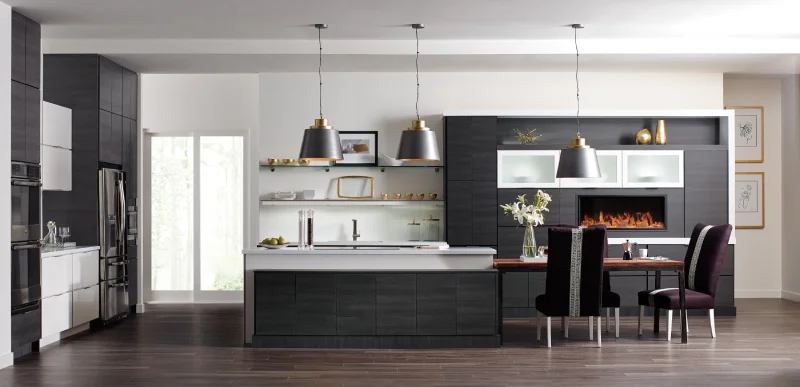 Modern kitchen with central island and open fireplace.