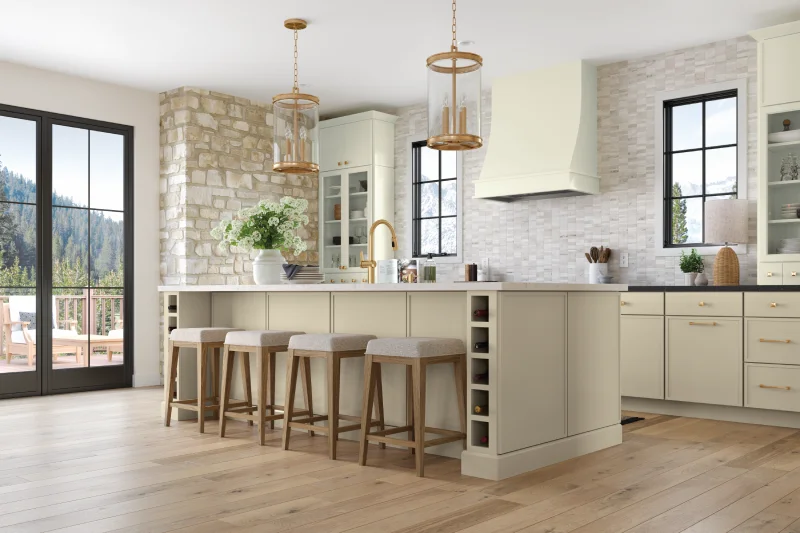 Modern off white kitchen with stone wall and island.