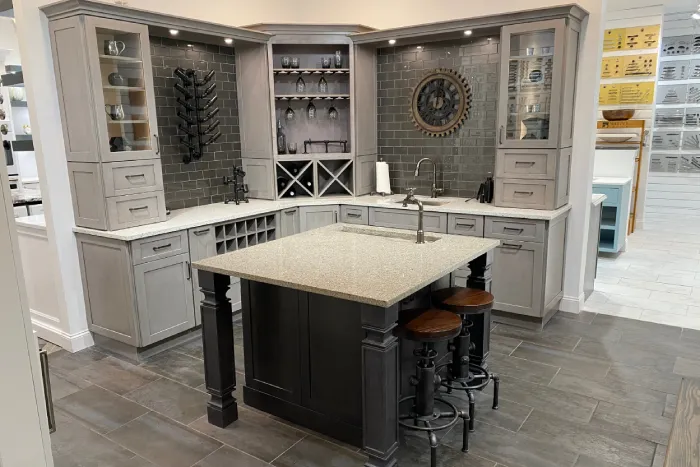 Large kitchen design studio featuring an island with seating.