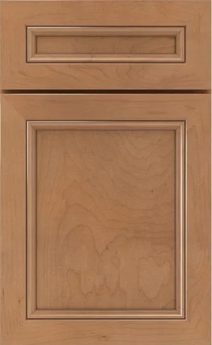 A close-up sample of a honey-oak stained cabinet door with raised center panels.