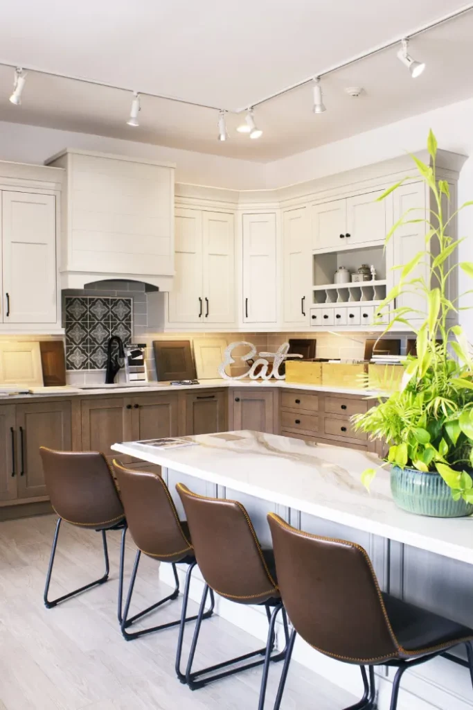 Elegant traditional kitchen with dual-tone wood cabinetry and island.