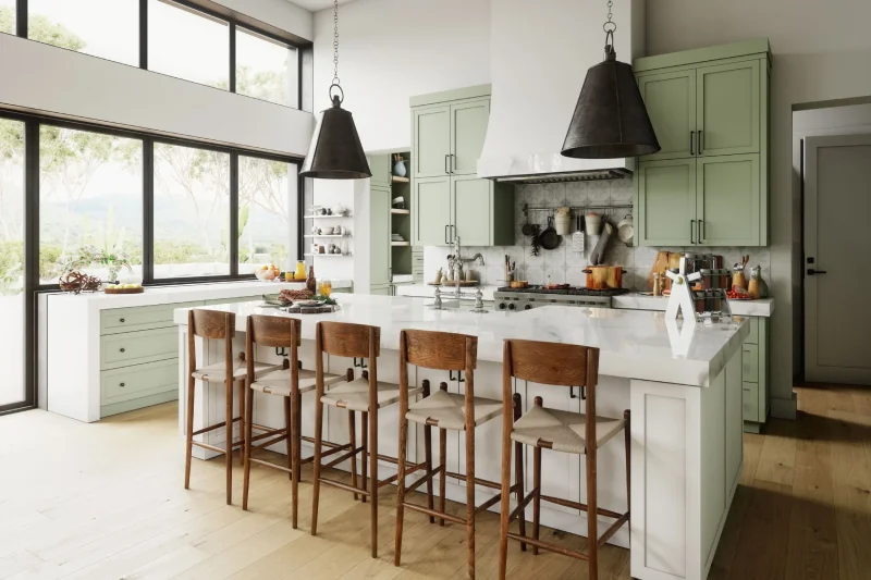 Modern kitchen featuring light sage green cabinets and white island.